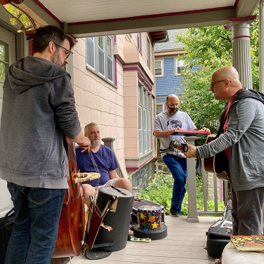 Jim and band playing on a porch